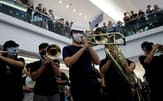 A group of music performers plays a protest song "Glory to Hong Kong" during an anti-extradition bill protest in flash mob inside a shopping mall at Kowloon Tong, in Hong Kong, China, September 18, 2019. REUTERS/Tyrone Siu